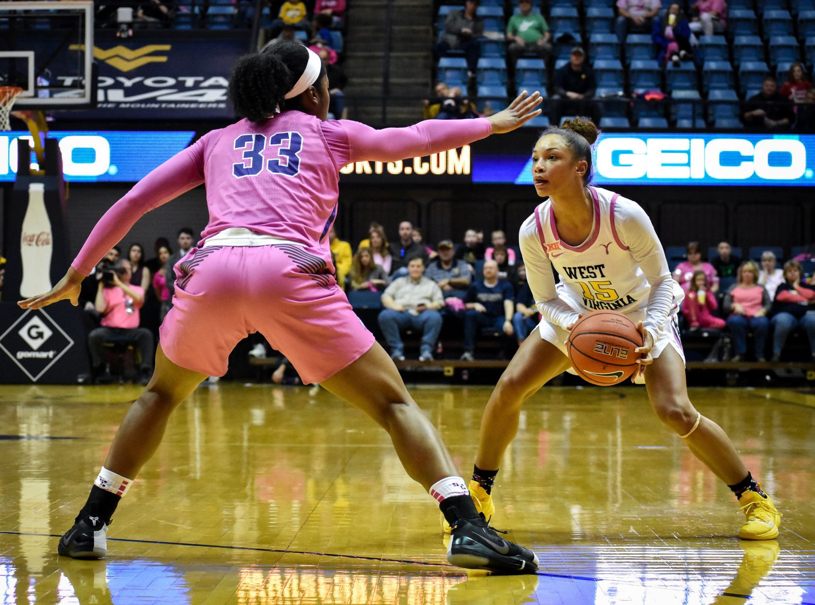 West Virginia’s Lucky Rudd looks downcourt while being guarded by TCU’s Adeola Akomolafe